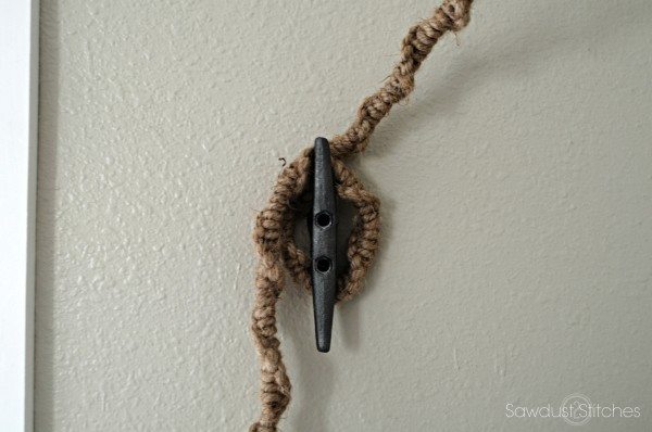 Use a rope cleat to tie off a ceiling mounted lamp!